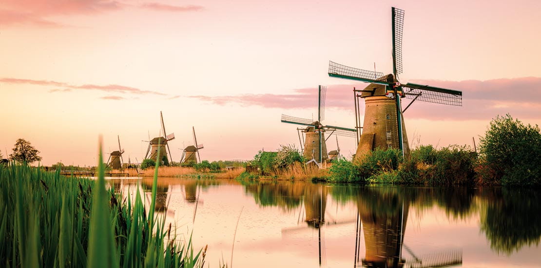 The windmills in Kinderdijk at sunset, Netherlands